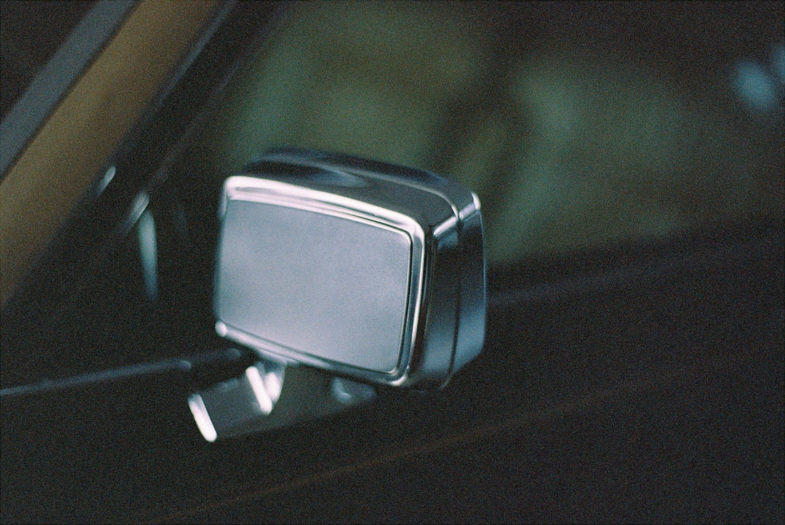 black car side mirror during daytime
