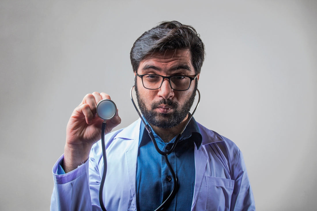 man in blue button up shirt wearing black framed eyeglasses