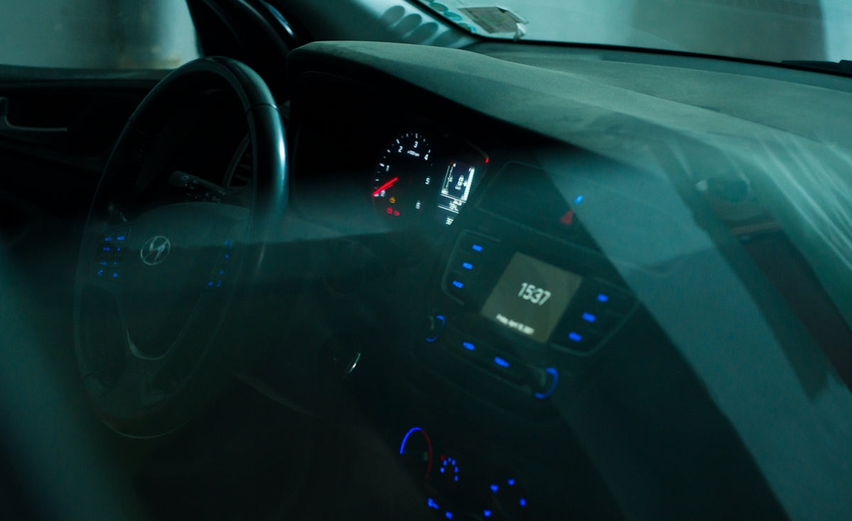 black car stereo turned on during nighttime