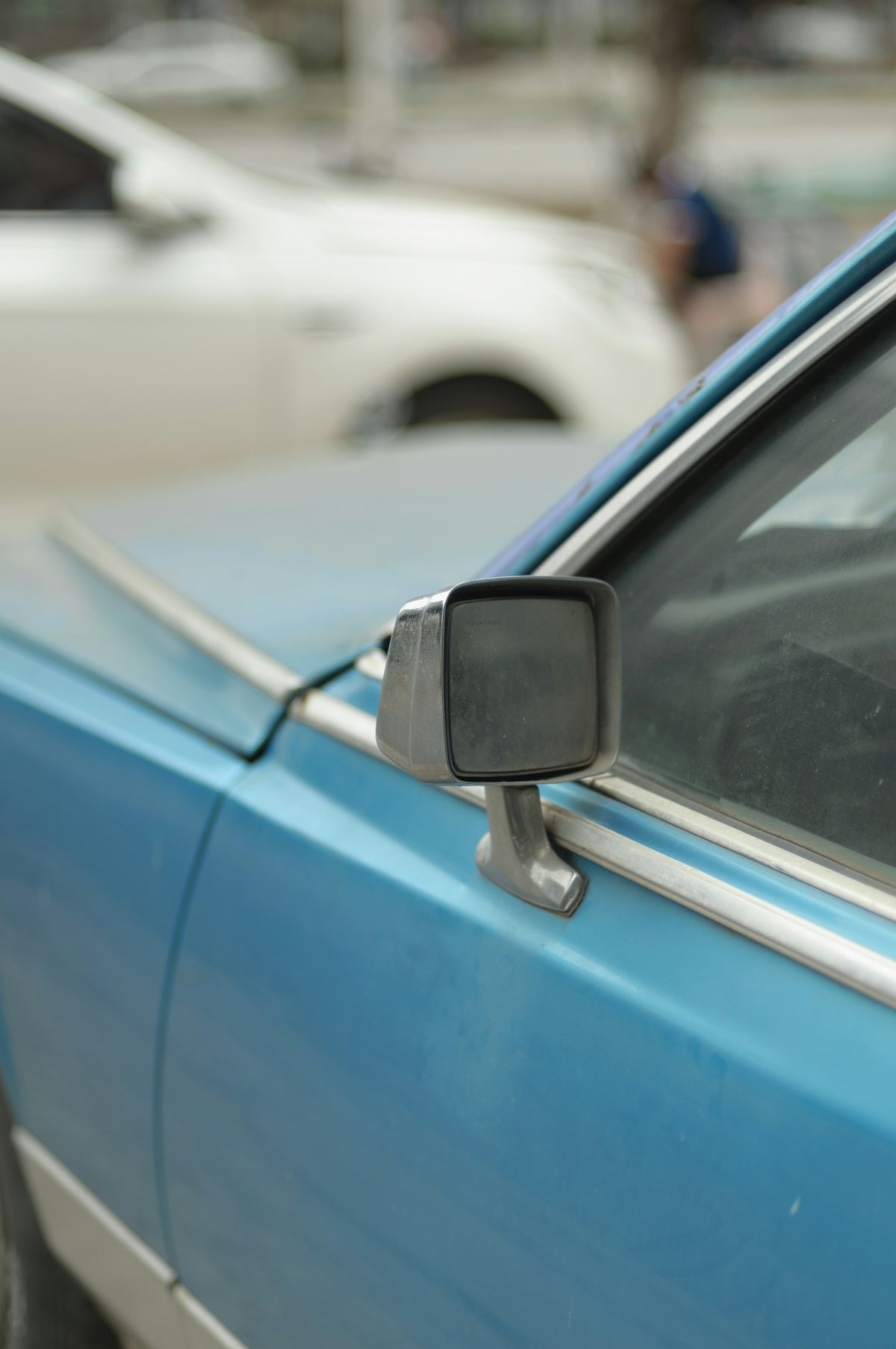 black car side mirror during daytime