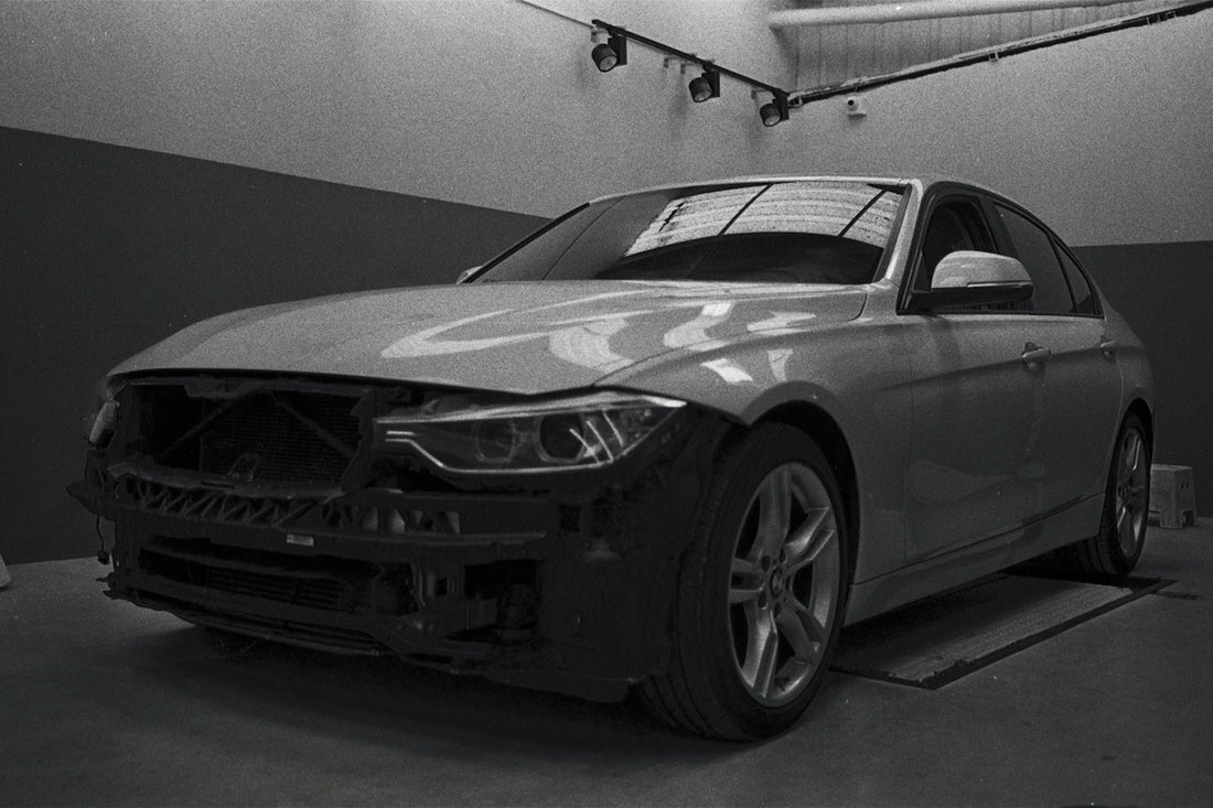 a black and white photo of a car in a garage