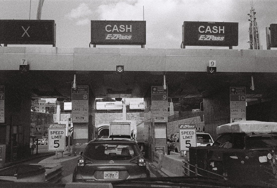 a black and white photo of a gas station