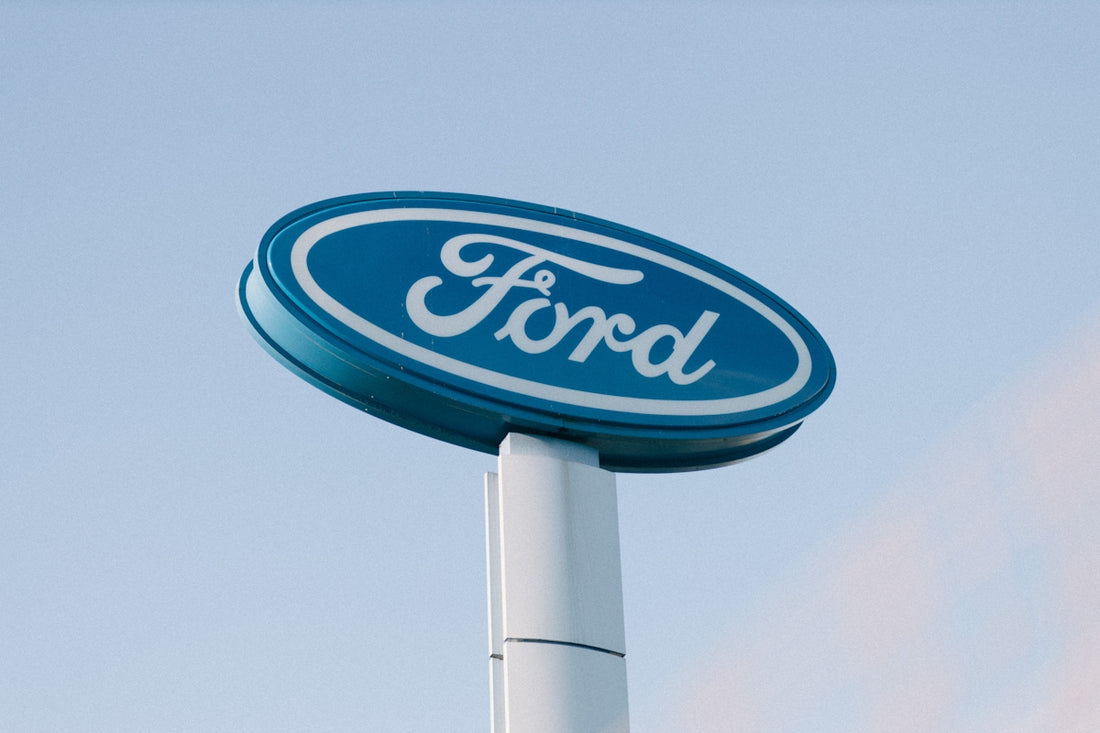 a ford sign is shown against a blue sky
