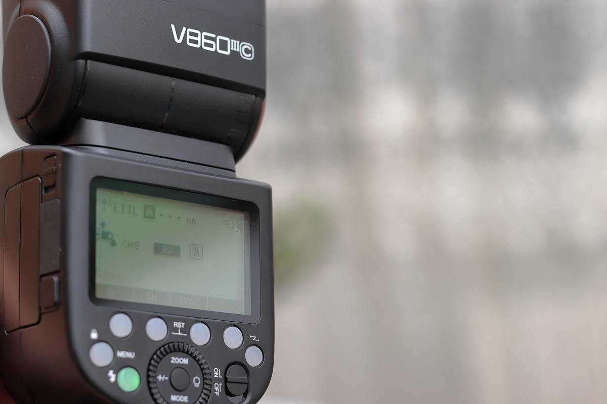 a close up of a digital camera with a blurry background