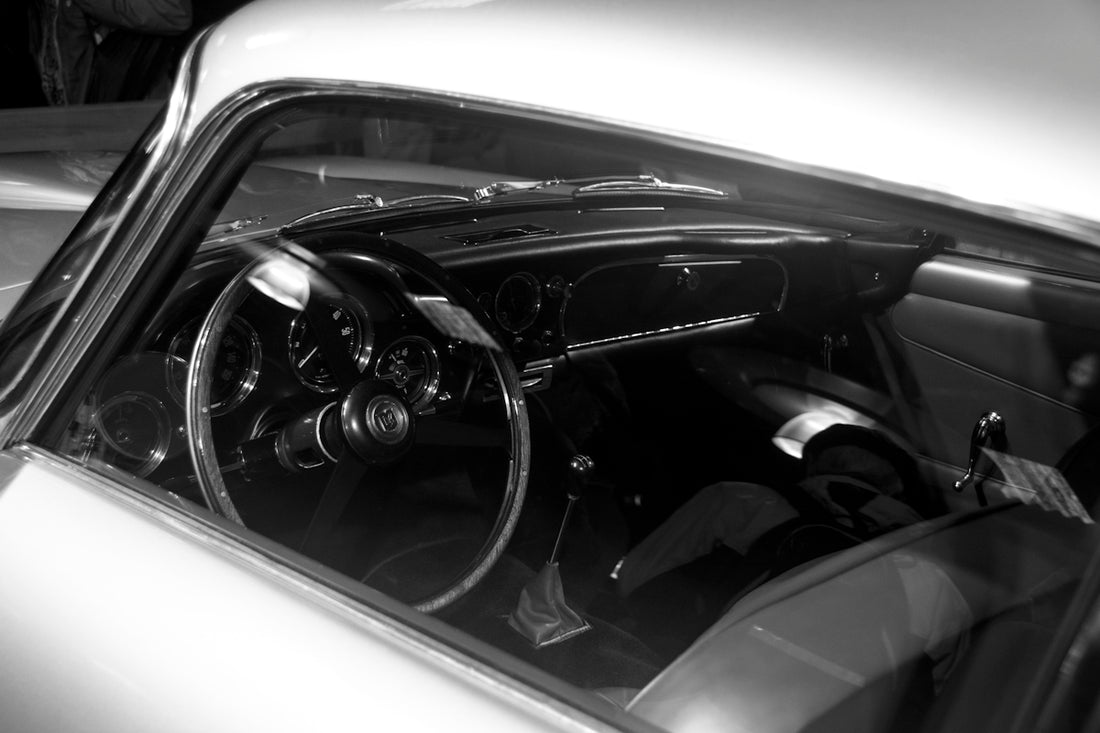 a black and white photo of a car's dashboard