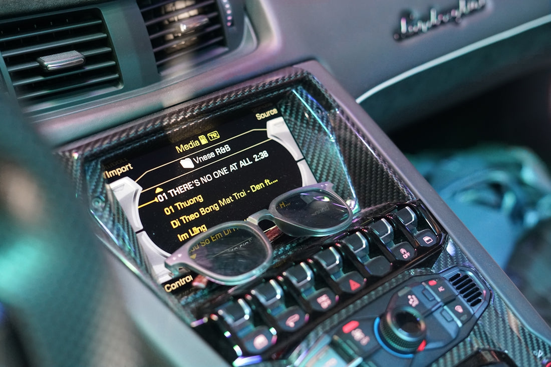 A car dashboard with a steering wheel and a dash board