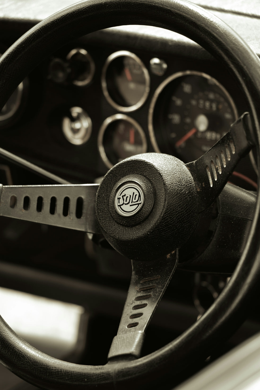 A steering wheel and dashboard of a car
