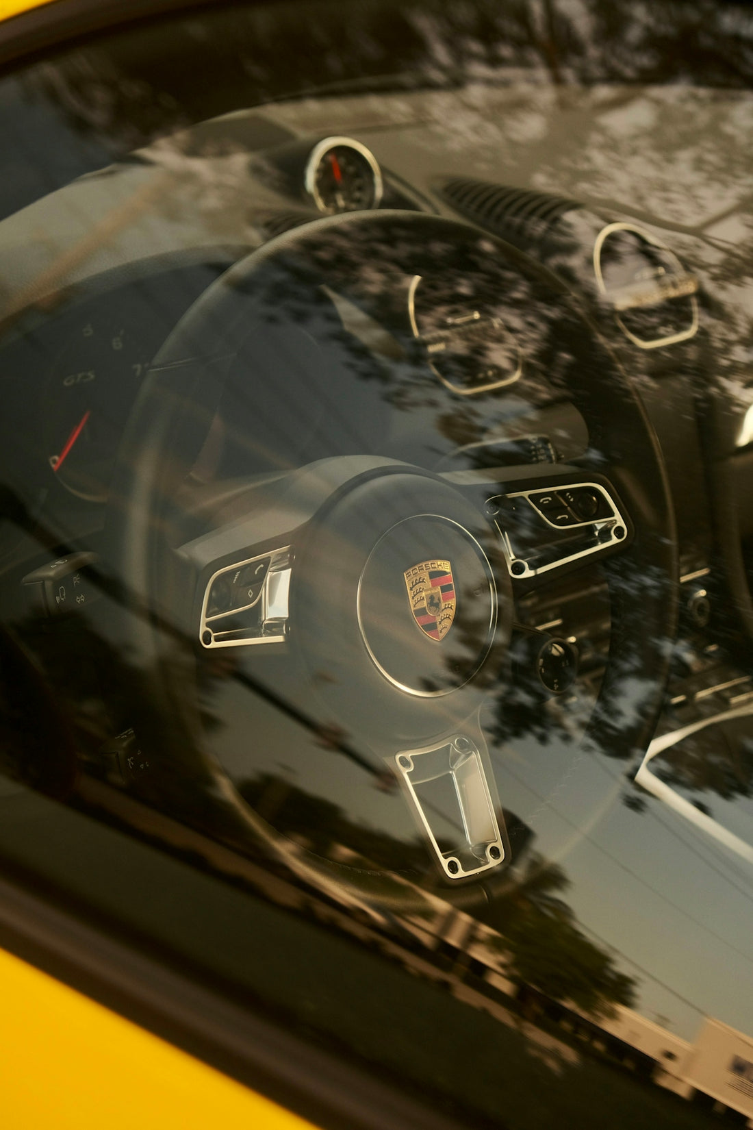 The interior of a yellow sports car