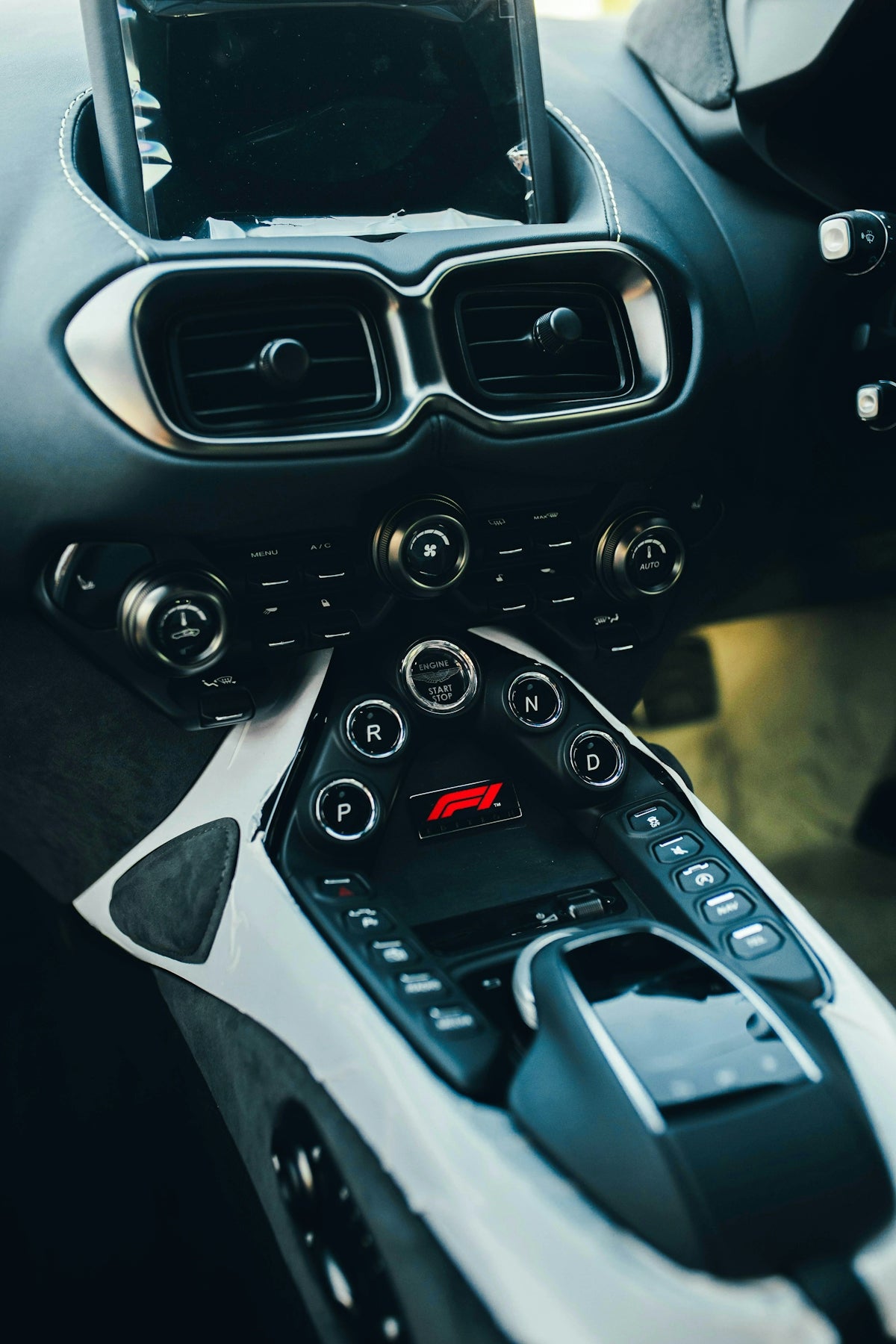 A close up of a steering wheel and dashboard of a car