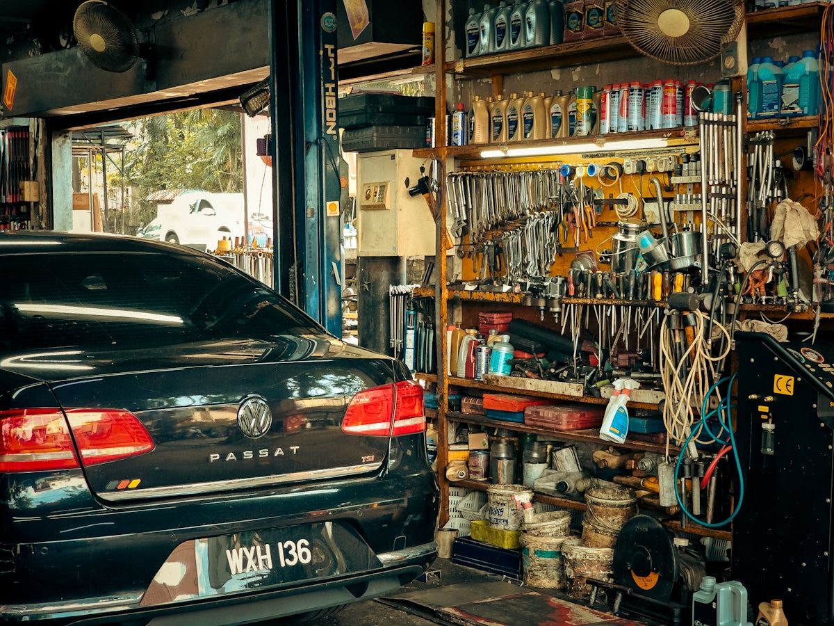 A car parked in front of a store filled with items
