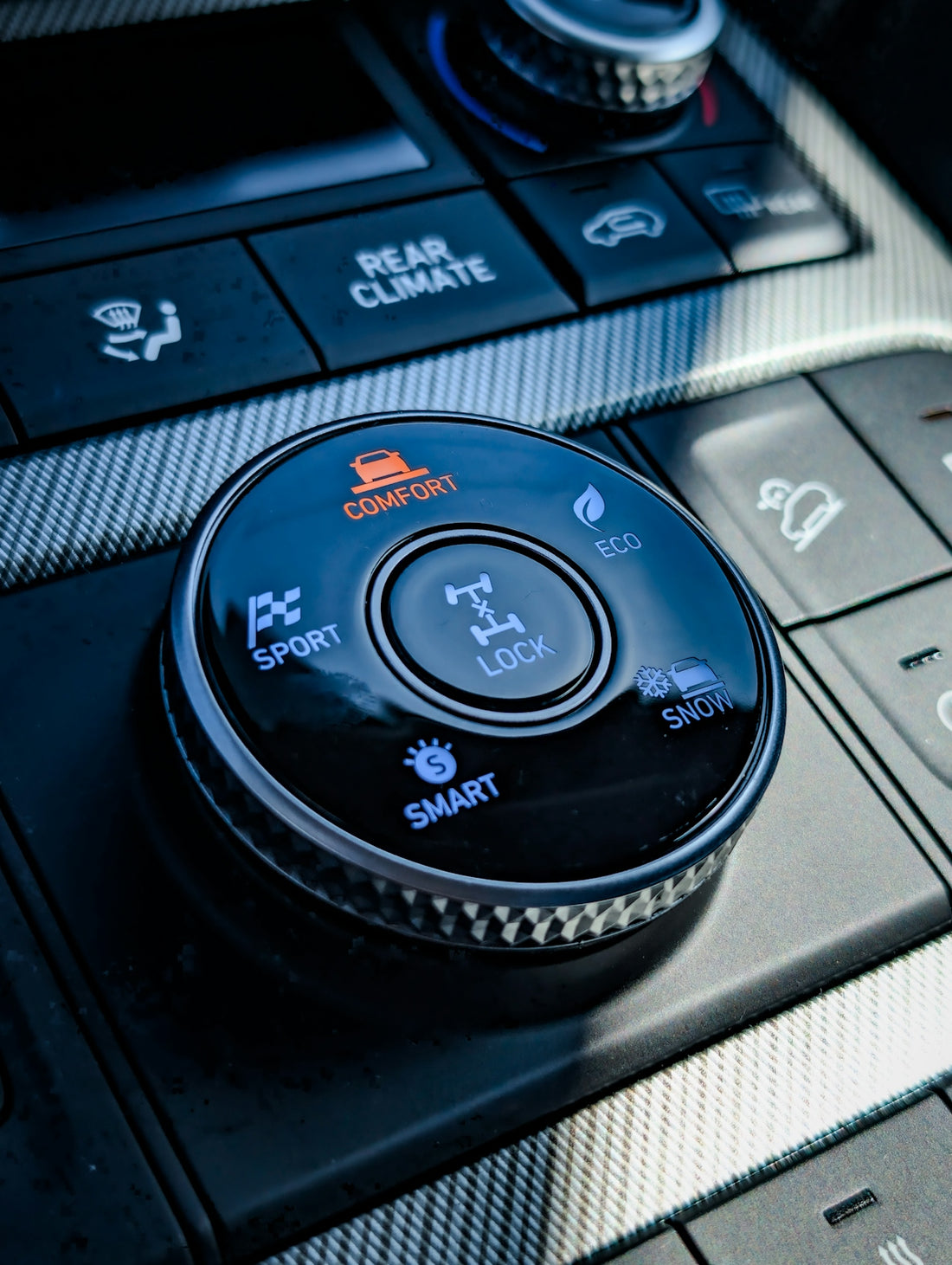 Car's interior control panel with different driving modes.