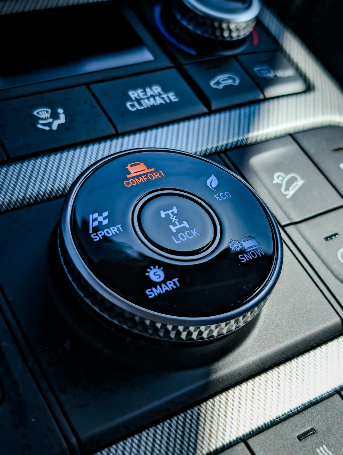 Car's interior control panel with different driving modes.