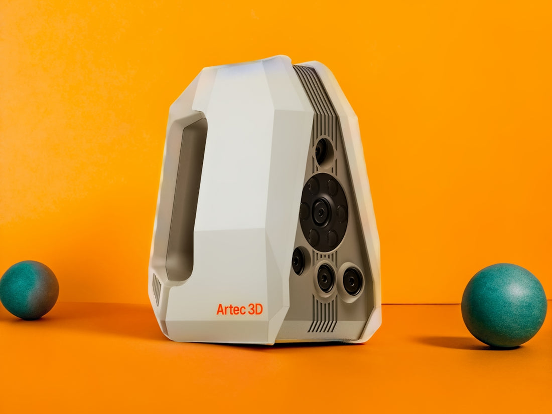 A 3D scanner and two teal colored spheres.