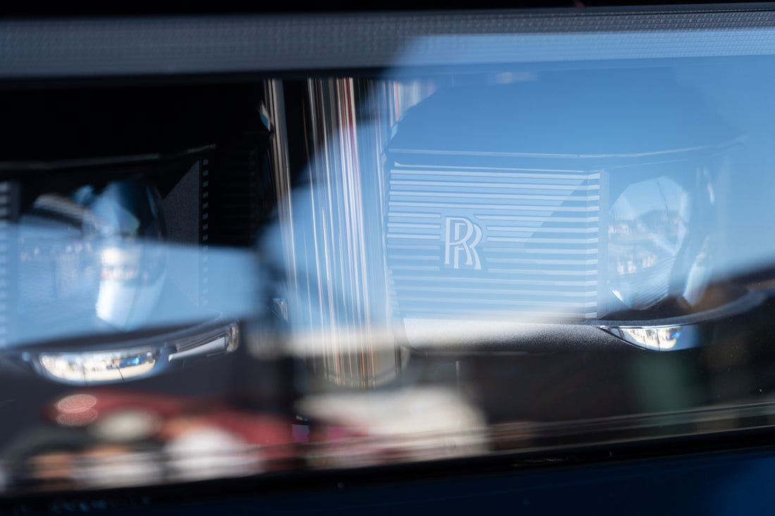 Reflections show the rolls royce emblem.