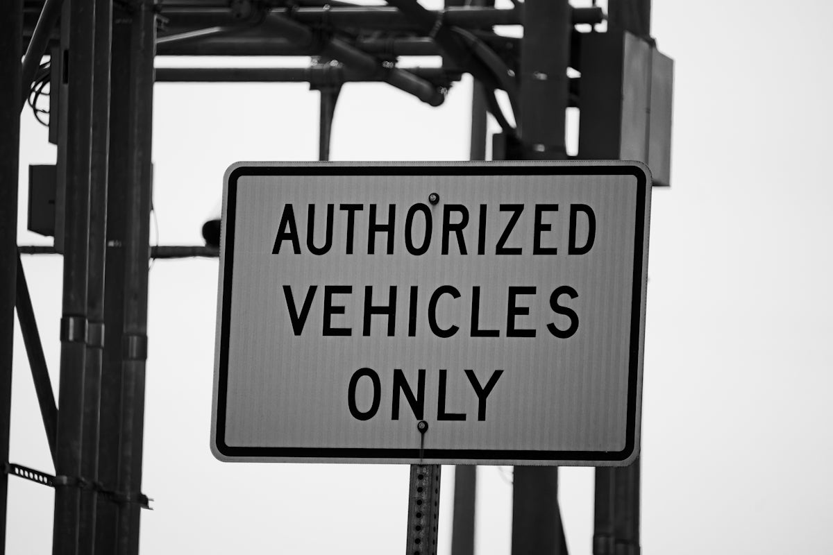 Authorized vehicles only sign on sign